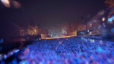 a blurry photo of a crowd of people at a concert