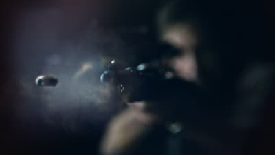 a blurry photo of a person holding a camera