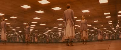 a group of people standing in a large room