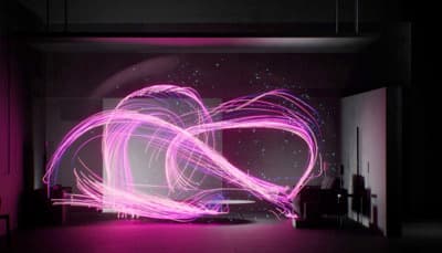a purple light painting in a dark room