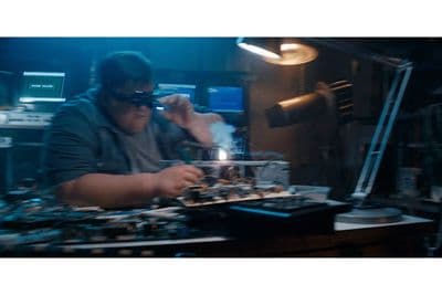 a man working on a machine in a factory