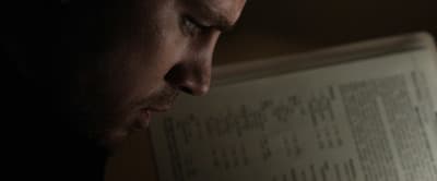 a close up of a person reading a book