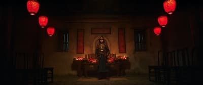 a woman standing in a dimly lit room