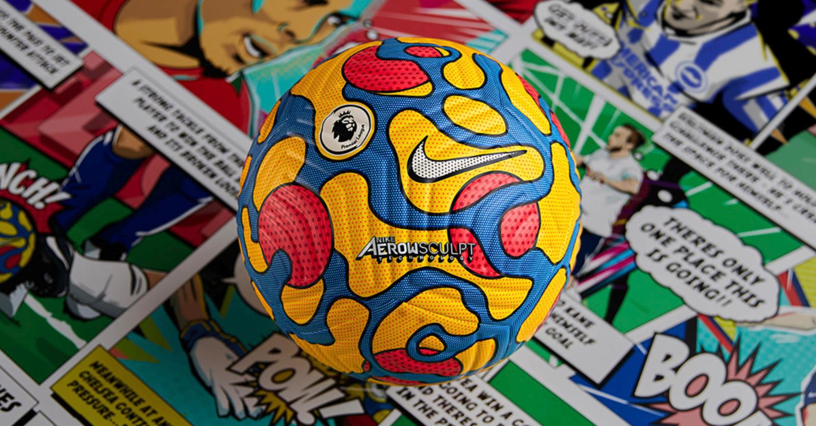 a yellow and blue ball sitting on top of a pile of stickers