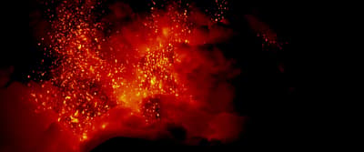 a red and black photo of a volcano