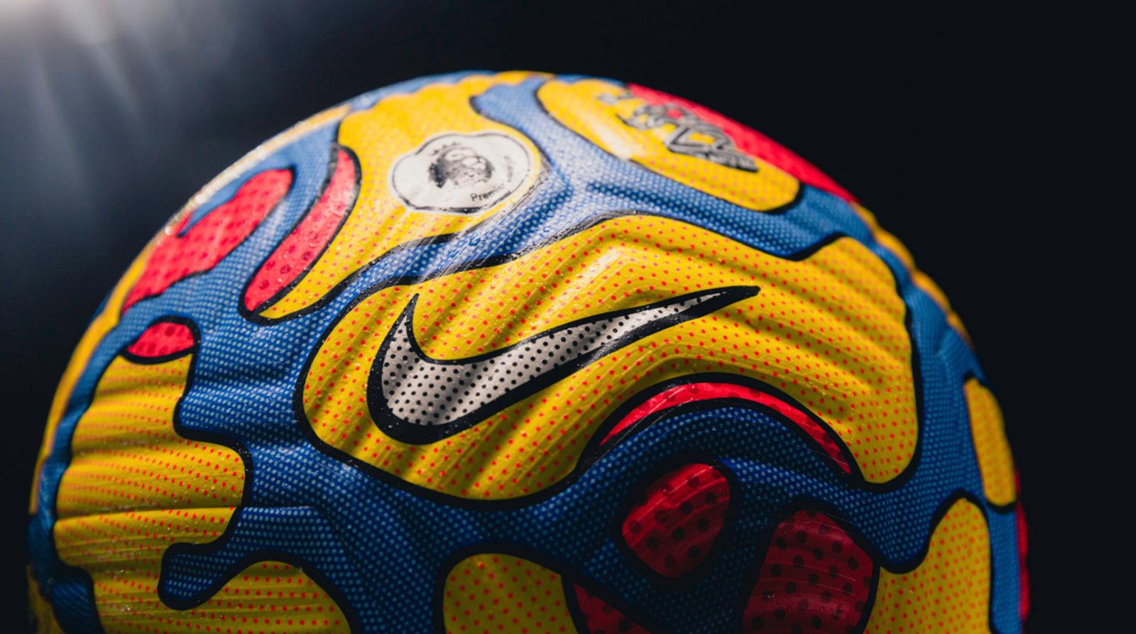 a close up of a soccer ball on a black background