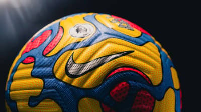 a close up of a soccer ball on a black background