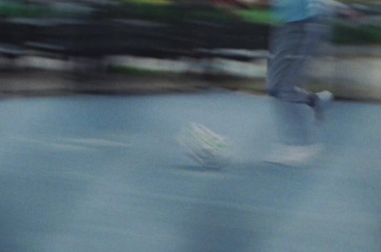 a blurry photo of a person riding a skateboard