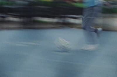 a blurry photo of a person riding a skateboard
