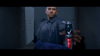 a man holding a hair dryer in his hand