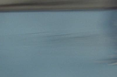 a blurry photo of a person riding a skateboard