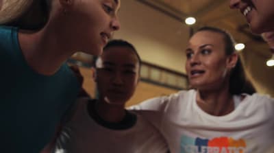 a group of women standing next to each other
