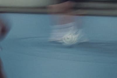 a blurry photo of a white object in motion