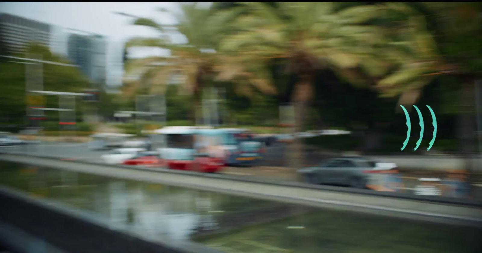 a blurry photo of a city street with palm trees