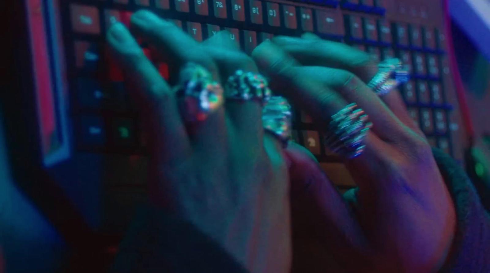 a close up of a person typing on a keyboard
