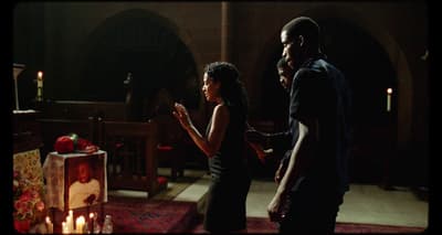 a man and a woman standing in a church