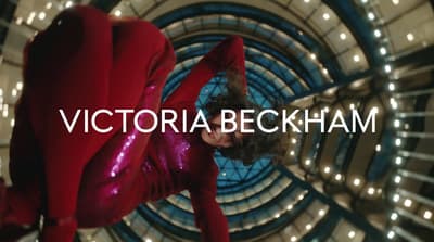 a woman in a red outfit is dancing