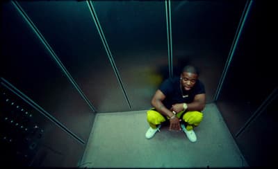 a man sitting on the floor in a room