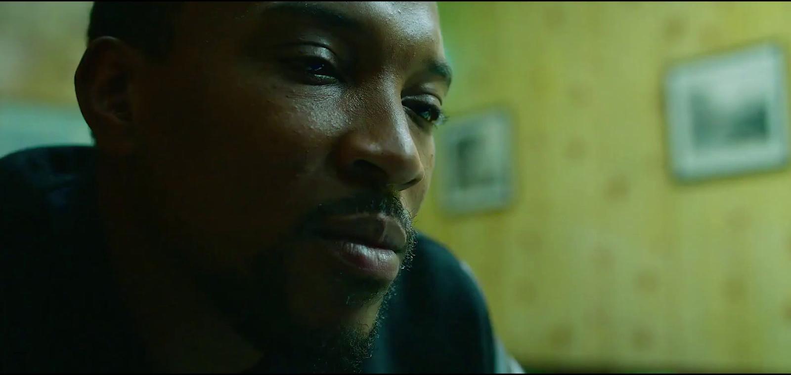 a close up of a person wearing a black shirt
