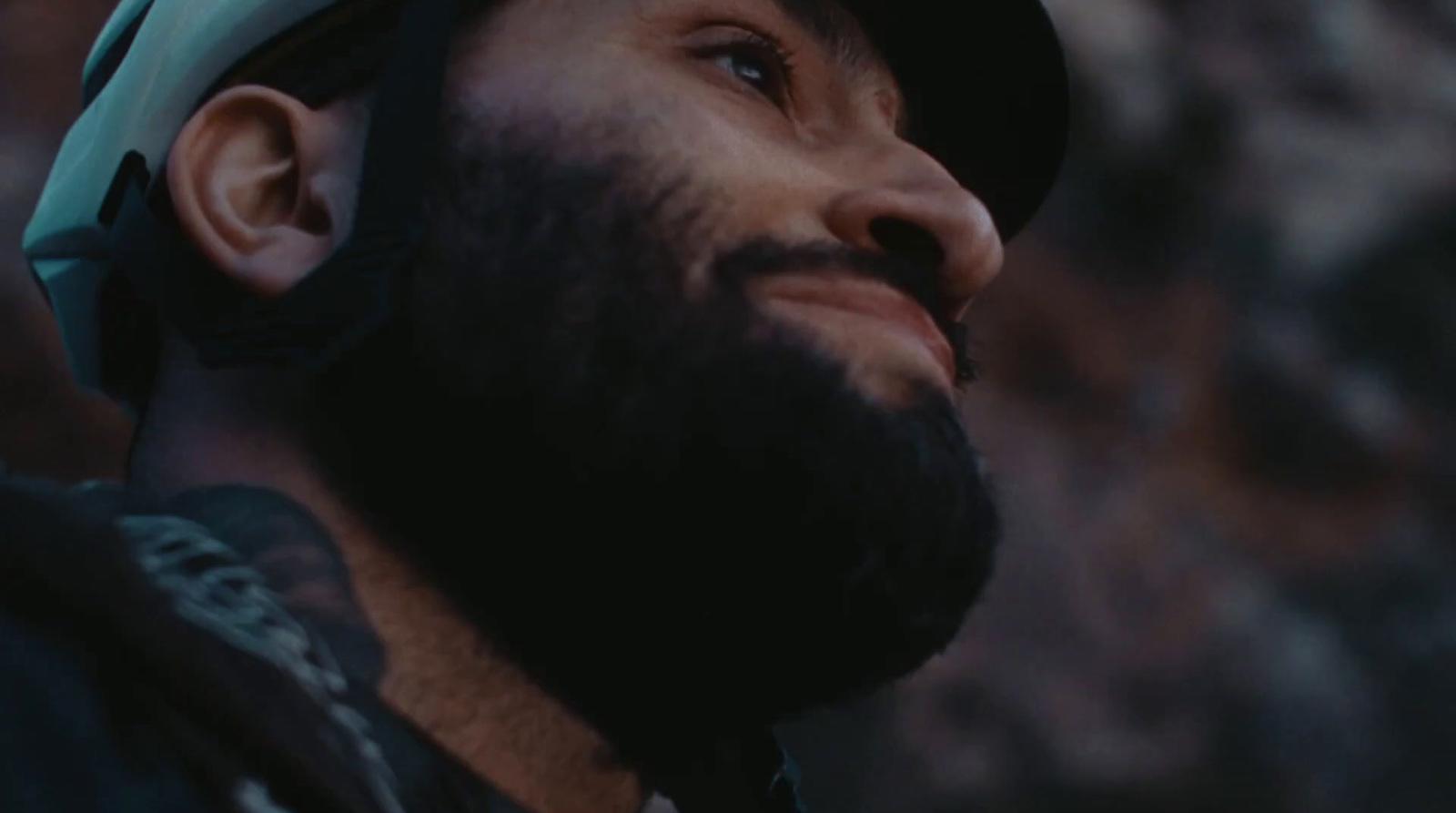 a man with a beard wearing a helmet