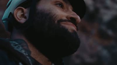 a man with a beard wearing a helmet