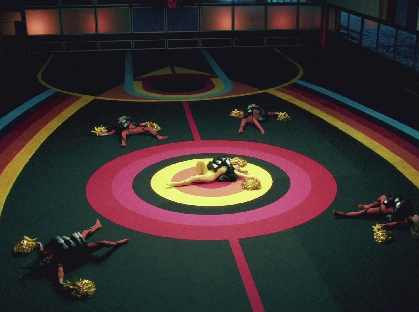 a group of people laying on top of a wrestling ring