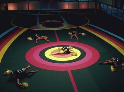 a group of people laying on top of a wrestling ring