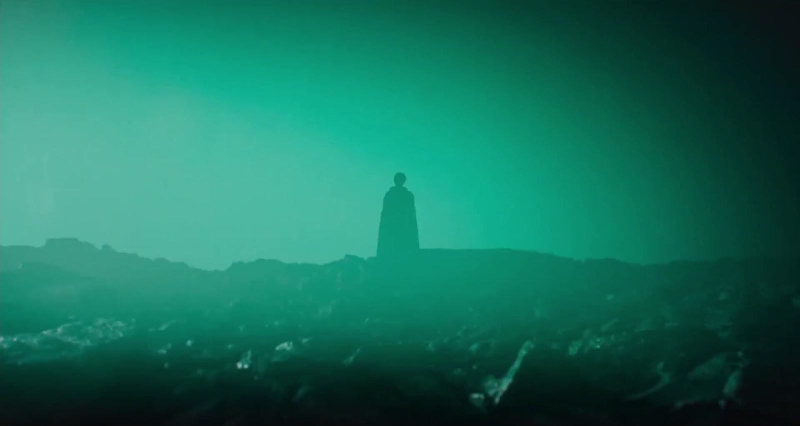 a person standing on top of a hill