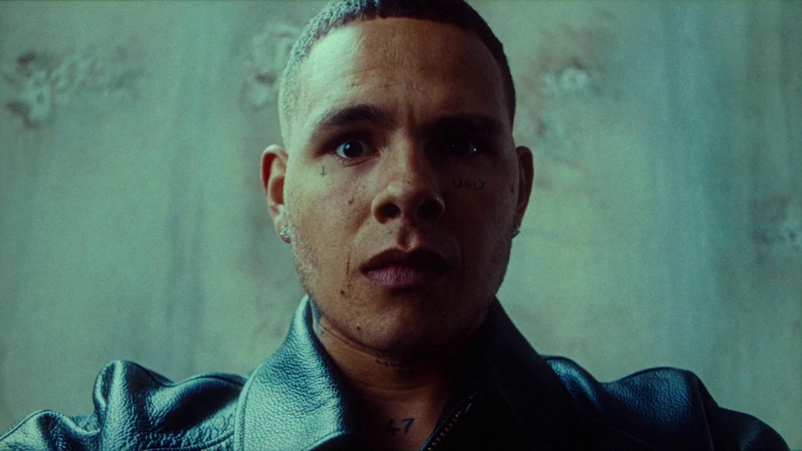 a close up of a person wearing a leather jacket