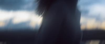 a blurry photo of a person holding a cell phone