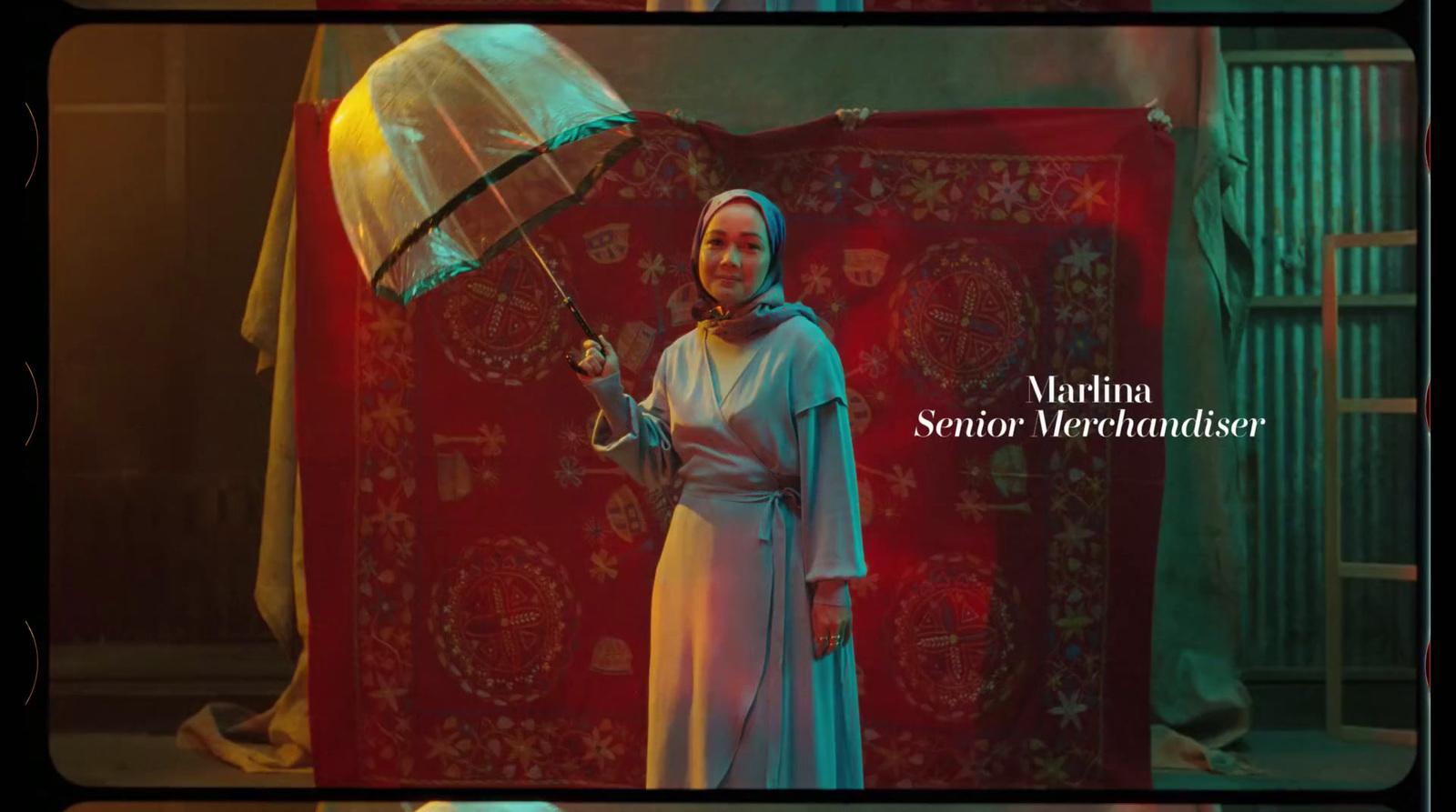 a woman in a white dress holding an umbrella
