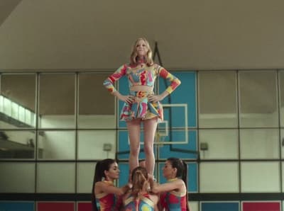 a group of young women standing on top of each other