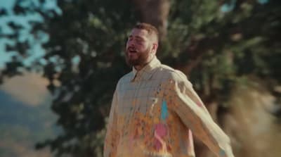 a man with a beard and a colorful shirt