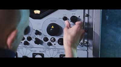 a close up of a person touching buttons on a machine