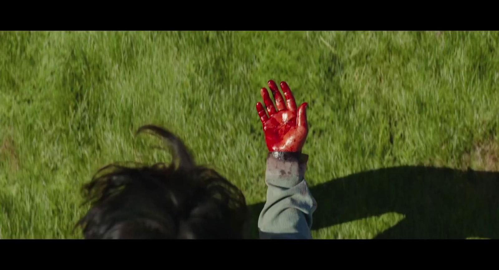 a person with their hand up in the air
