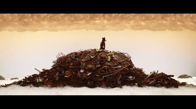 a man standing on top of a pile of rubble
