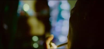 a blurry photo of a person holding a cell phone