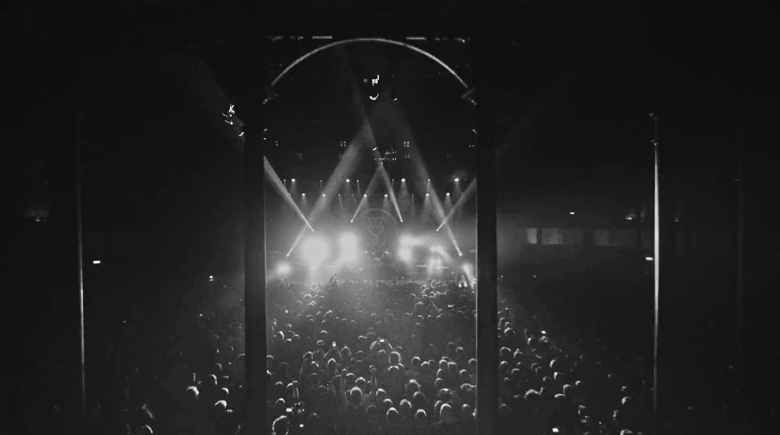 a black and white photo of a concert