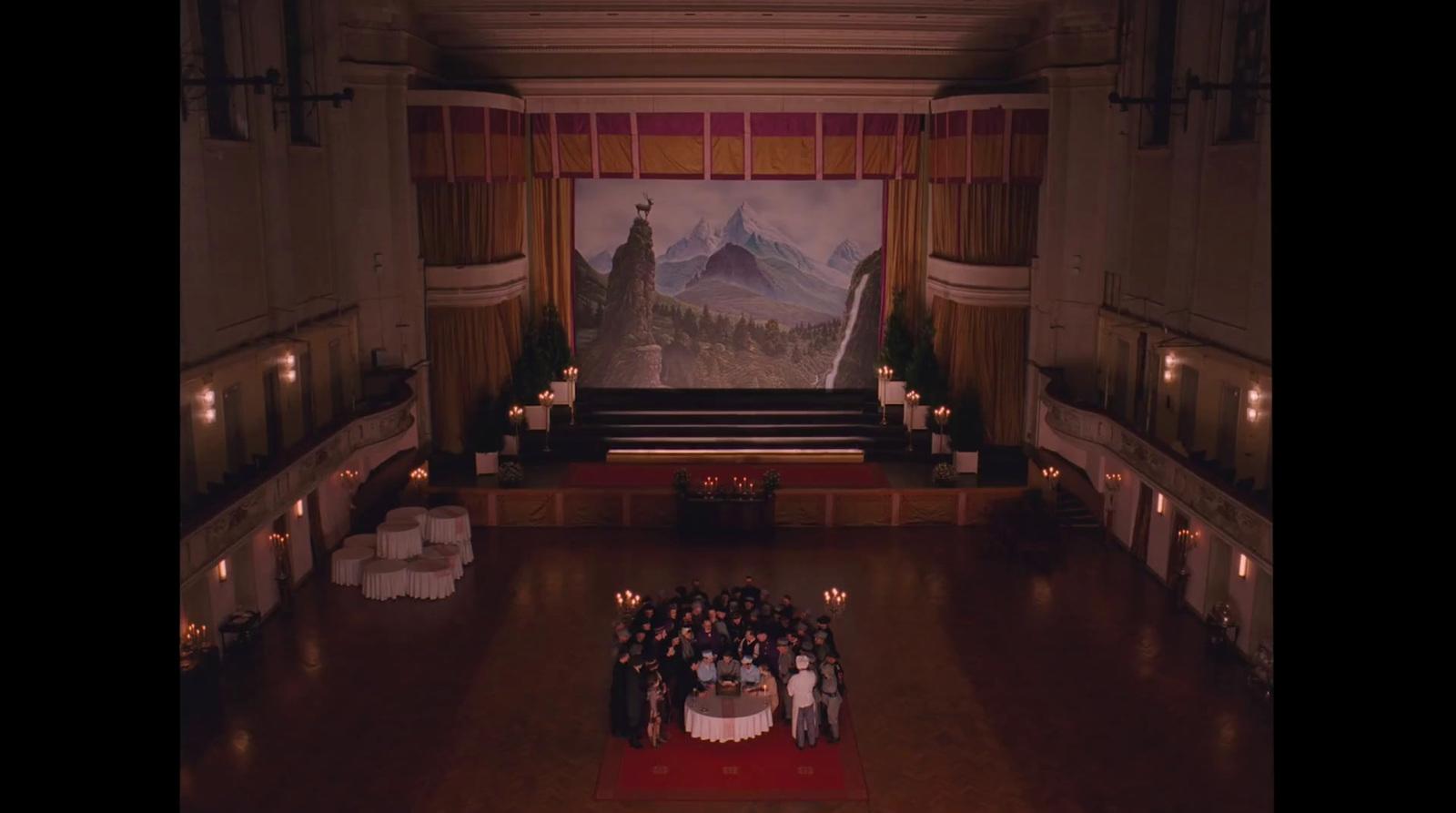 a group of people standing in front of a stage