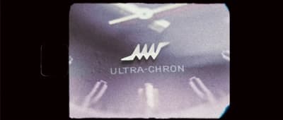 a close up of a watch face with the words ultra - chron on it