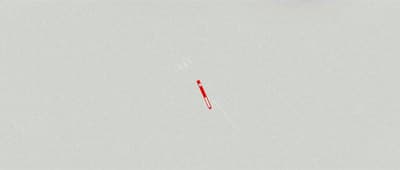 a red object is flying through the sky