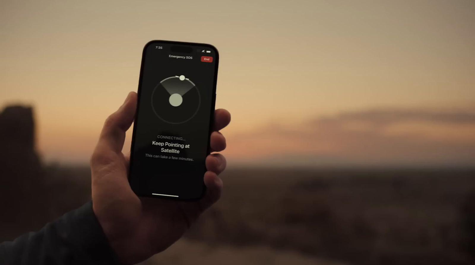 a person holding a cell phone in their hand