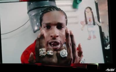 a man with his hands in front of his face