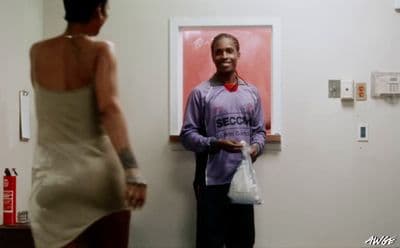 a man standing next to a woman in a room