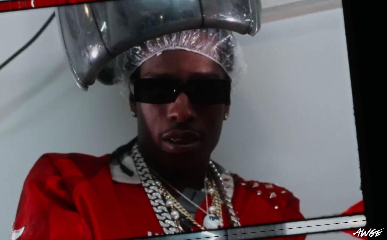 a man in a red outfit with a silver hat on his head