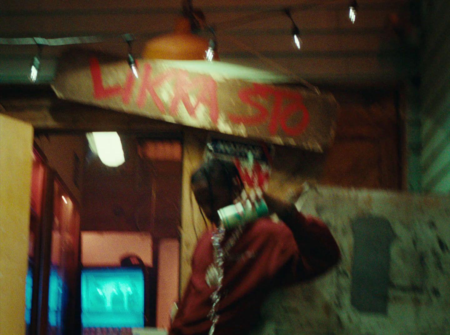 a man holding a skateboard over his head