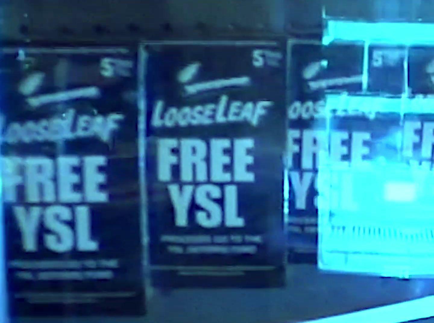 a store front window with posters on it