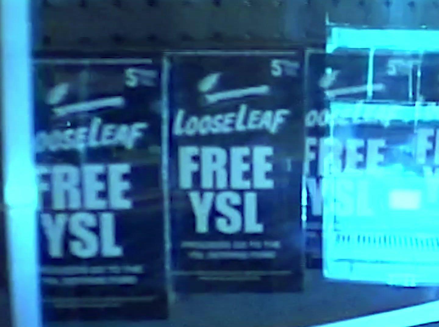 a store front window with a free vsi sign on it