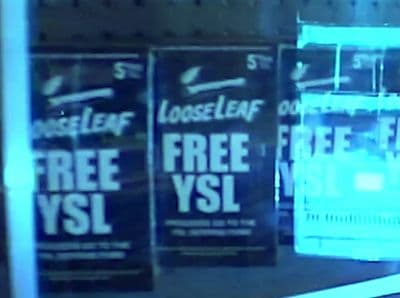 a store front window with a free vsi sign on it