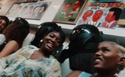 a group of women sitting next to each other